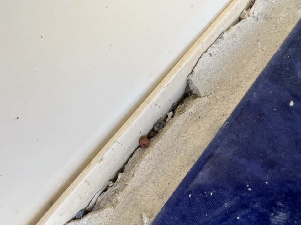 Cracked spa cement undergoing repair.